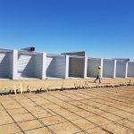 Looking closely you can see there is a full cinderblock wall to three sides of each unit that is then covered by a layer of steel.